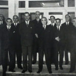 H.R.H. and the board of directors at the sports pavilion entrance - Desmond Stratton is second from the right